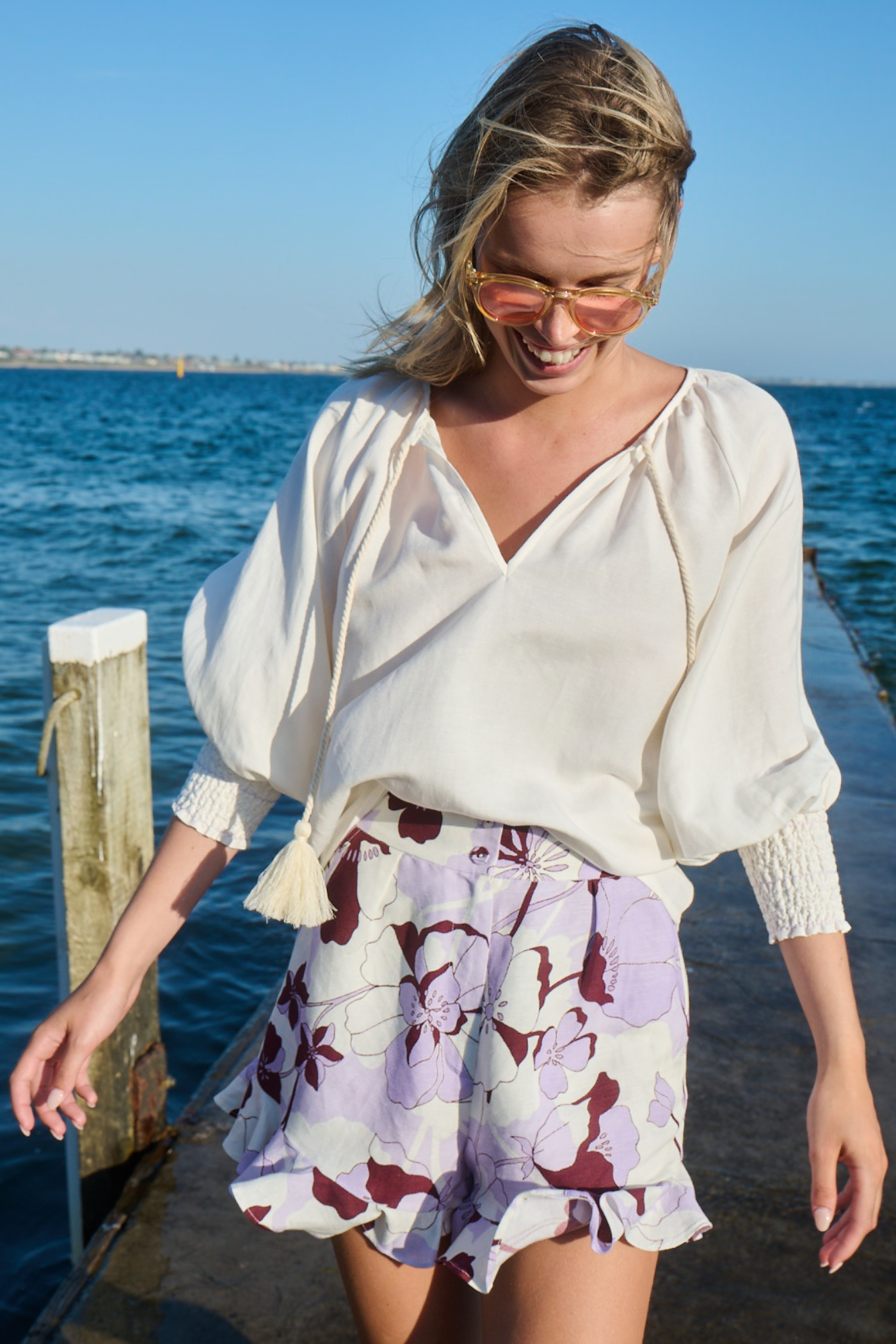 woman wearing purple printed ruffle shorts