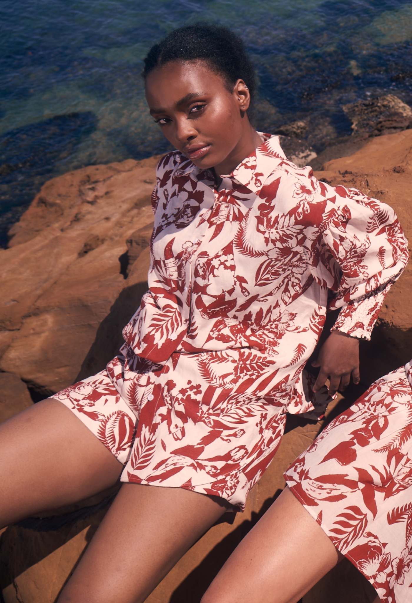 Model wearing matching linen printed set rust white print