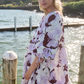 blonde woman wearing lilac print dress