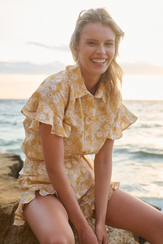 girl smiling wearing matching short top set