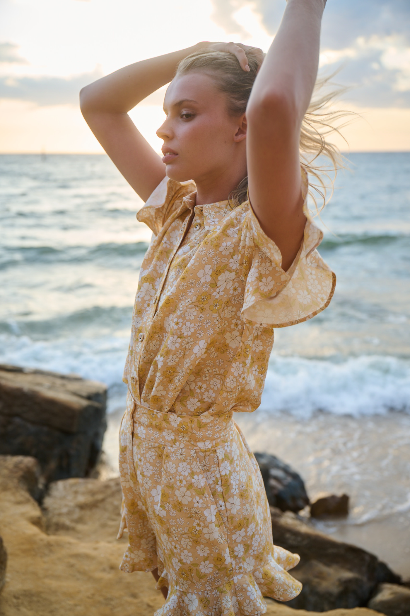 beach photoshoot wearing orange floral co ord