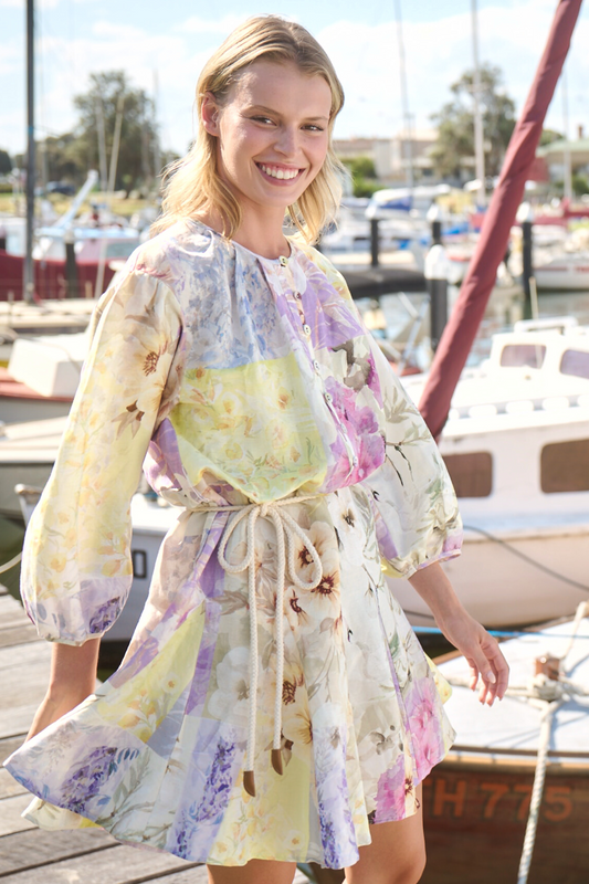 girl wearing long sleeve dress smiling