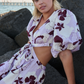 Blonde at beach wearing lilac linen dress