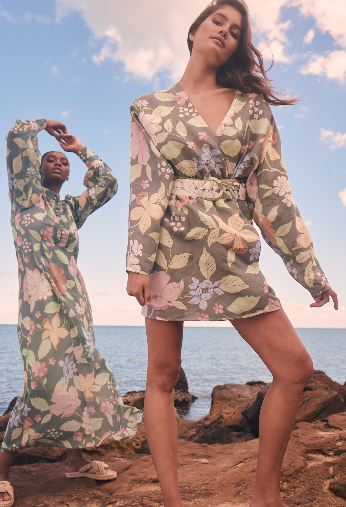 models posing at the beach in green floral dresses