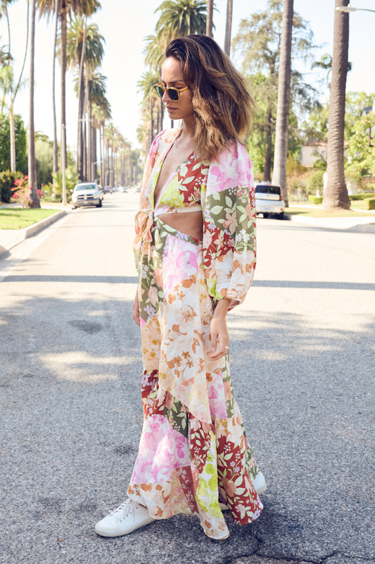 model posing in street wearing colourful dress