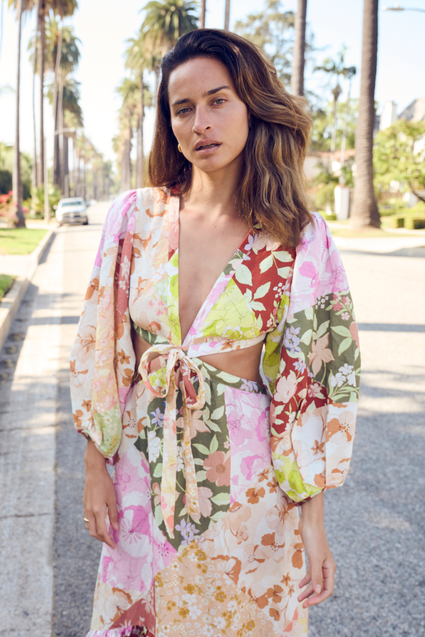 woman wearing printed maxi dress with cut outs