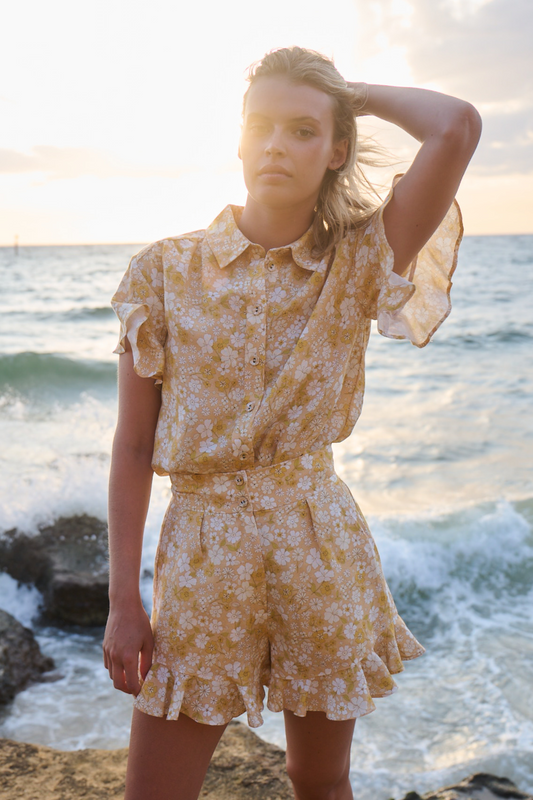 sunset photo girl wearing printed shirt and short set 
