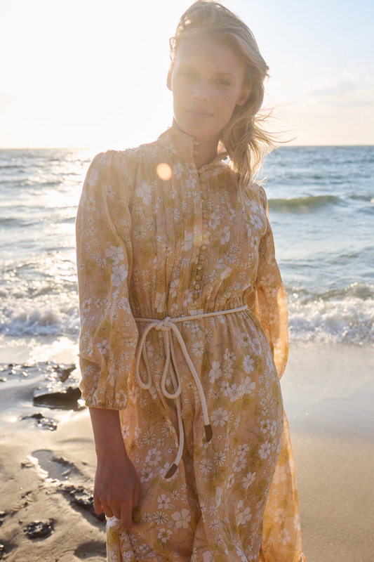 Model posing at sunset wearing maxi dress