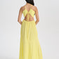 Model in backless yellow tie up maxi dress