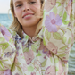 close up of model wearing floral printed shirt dress