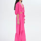 Model wearing pink maxi dress with cut outs
